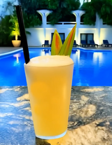 Melon cocktail made with Mizzica Melone Liqueur with fresh pineapple juice. This is a Mai Tai for people who want tropical. Poolside cocktail for summer days. 
