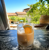 Mizzica Affogato cocktail in a glass with an orange slice