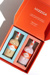 Two Mizzica liqueur bottles in a branded gift box.