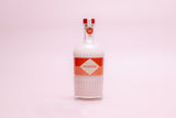 Bottle of Mizzica on a pink background