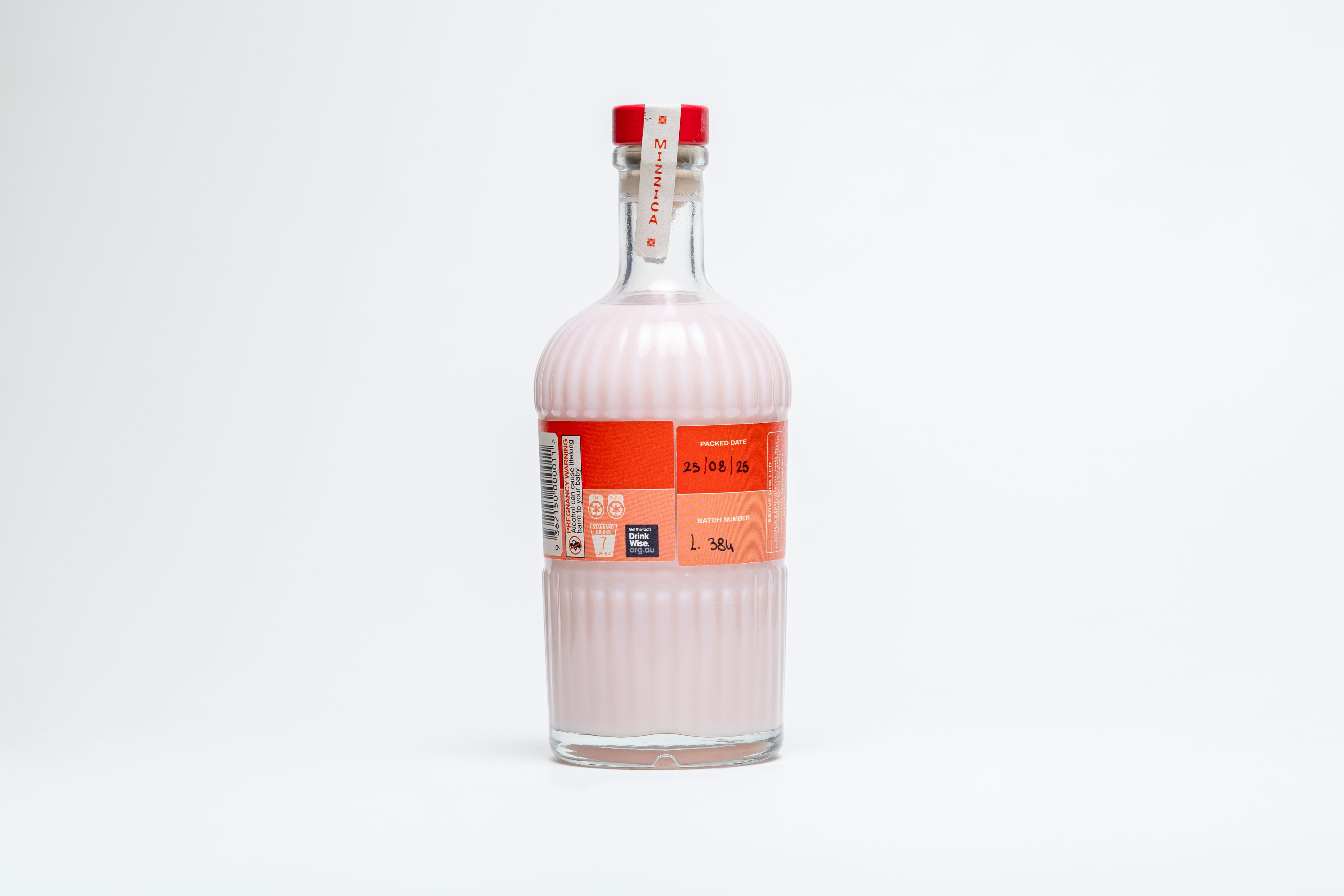 Clear Mizzica glass bottle with a red label on a white background